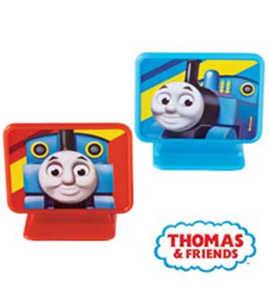 Two plastic Thomas the Tank Engine cake toppers, one with a red base and one with a blue base, featuring Thomas’s smiling.
