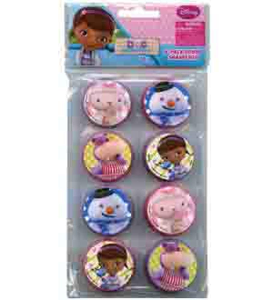 Eight round pencil sharpeners featuring colorful Doc McStuffins characters including Doc, Lambie, and Stuffy, in pink, blue,