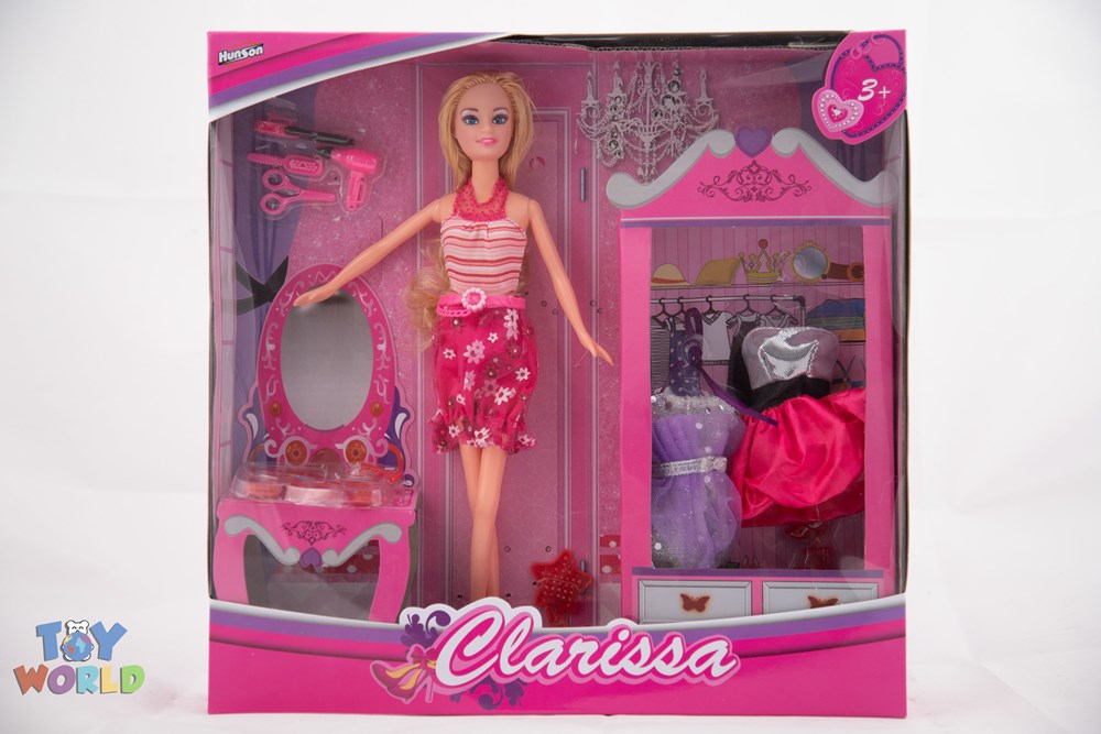 Bendable blonde doll in pink and white striped top and floral skirt with pink accessories in pink-themed packaging.