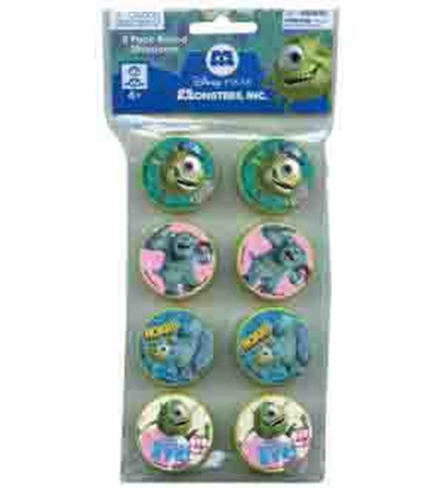 Set of eight round pencil sharpeners featuring Monsters University characters in bright blue and green tones with pink and.