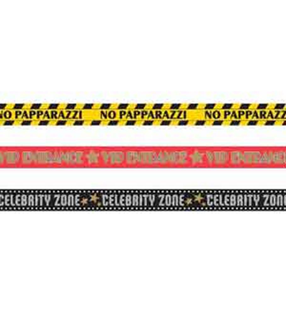Three rolls of decorative tape in yellow, red, and black with printed phrases "NO PAPARAZZI," "VIP DREAMS," and "CELEBRITY.