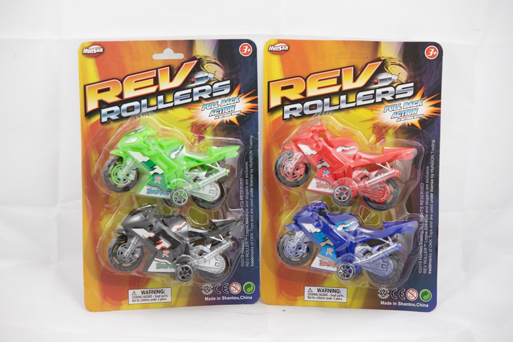 Four colorful friction-powered toy motorcycles in green, red, black, and blue, each about 5 inches long, packaged on orange.