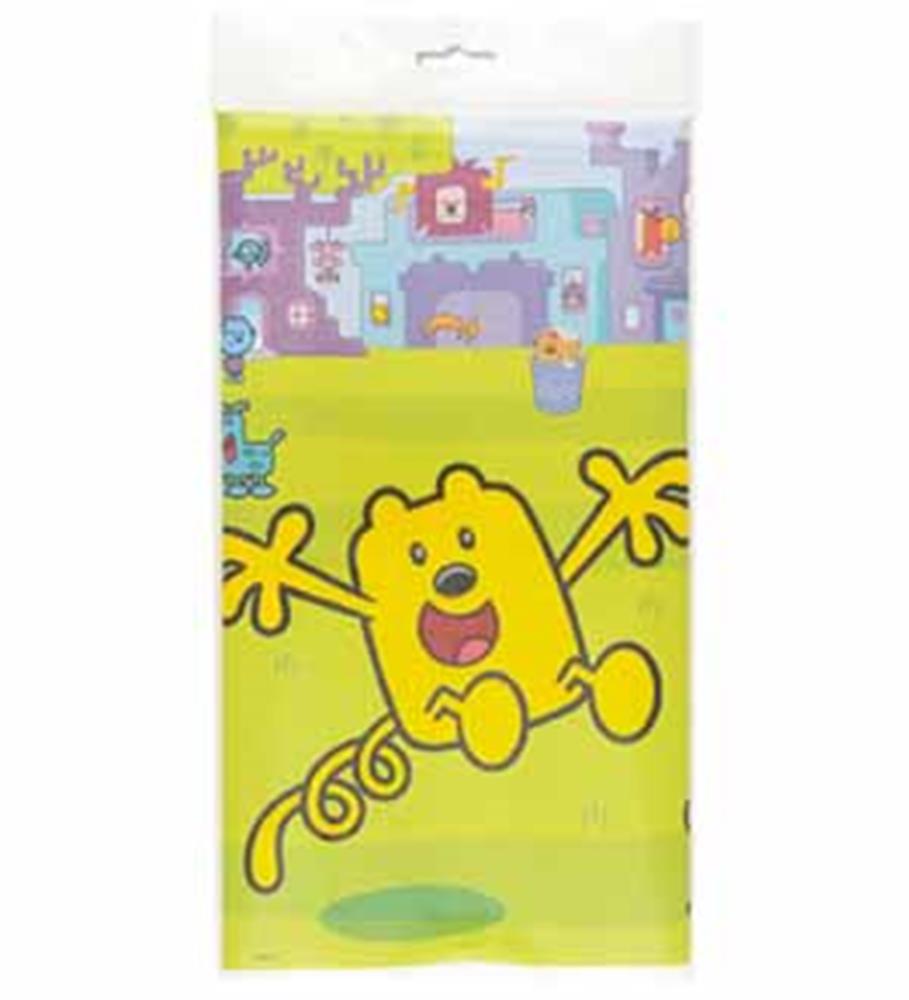 Yellow plastic tablecover featuring a large cartoon character with outstretched arms and playful background patterns.