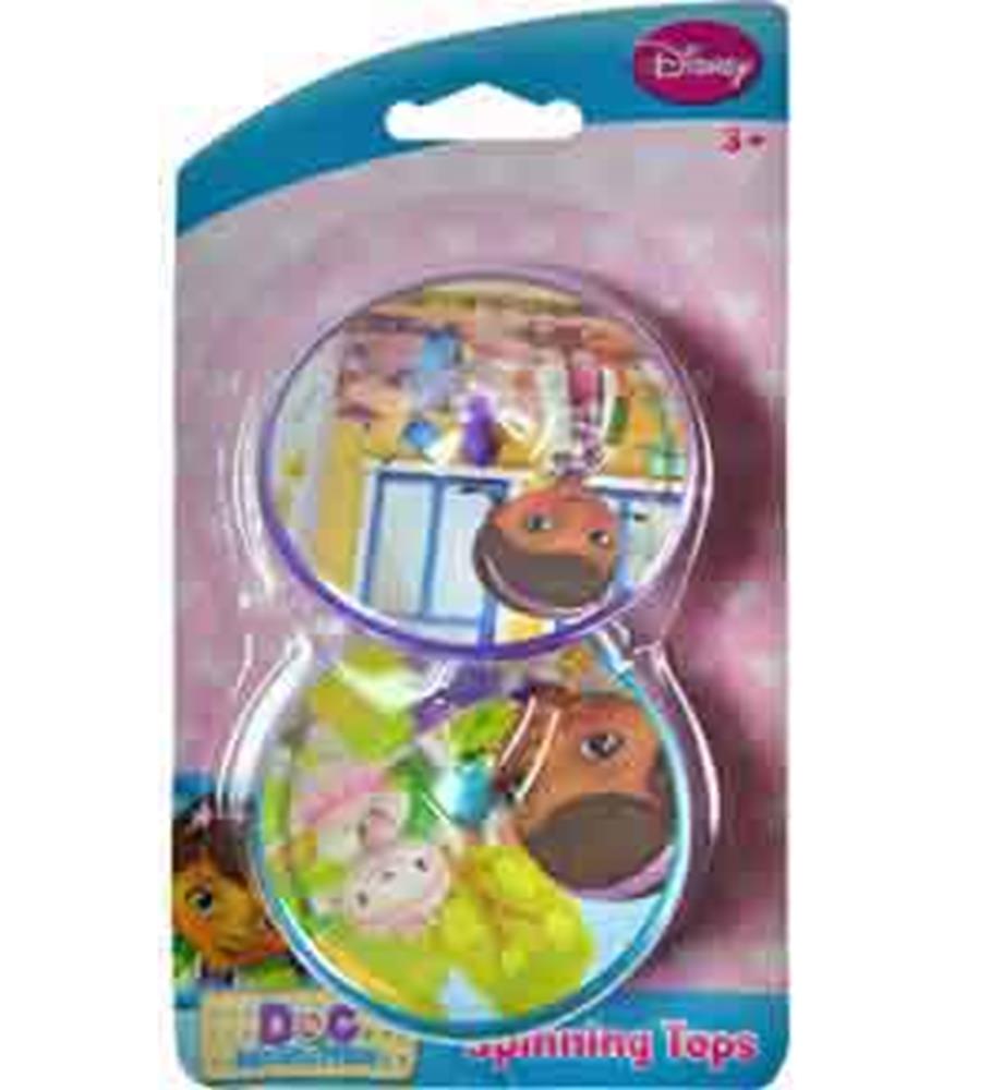 Two round spinning tops featuring colorful Doc McStuffins characters on plastic surfaces, packaged in clear plastic with a.