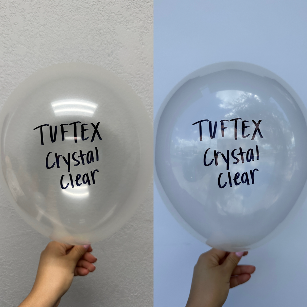Set of two large, clear 24-inch latex balloons with black "TUF-TEX Crystal Clear" text printed on them.