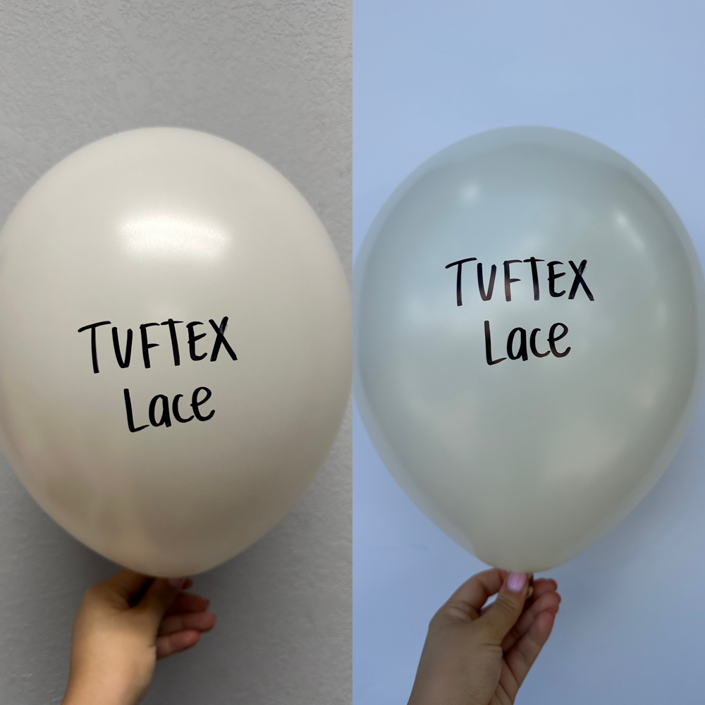 Two 24-inch white latex balloons with "Tuftex Lace" printed in black, held against a plain background.