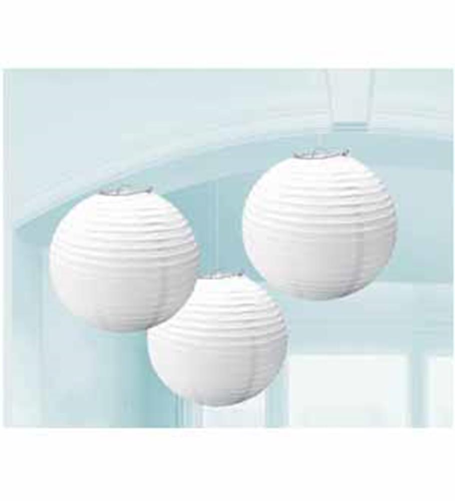 Set of three frosty white round paper lanterns with ribbed texture hanging indoors.