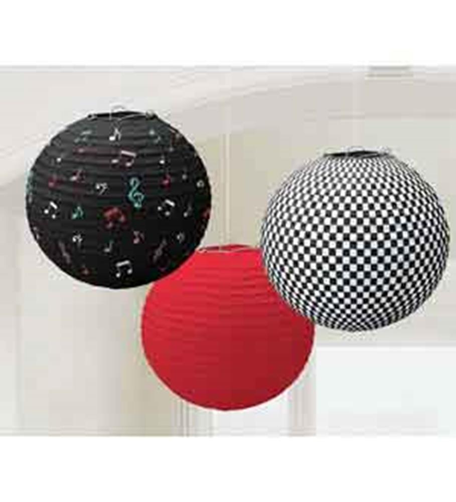 Black paper lantern with colorful musical notes, solid red paper lantern, and black-and-white checkered paper lantern.