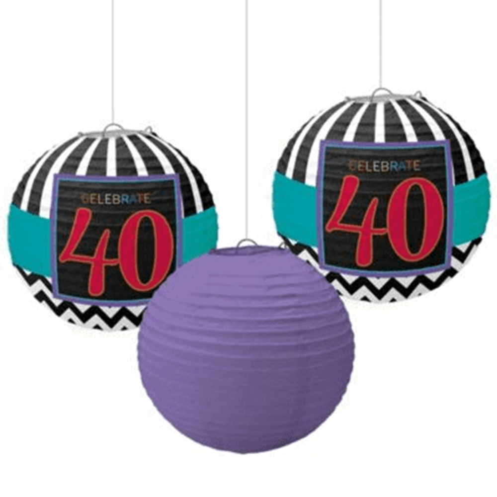 Set of three hanging paper lanterns with two black and turquoise lanterns featuring red "40" and one solid purple lantern.