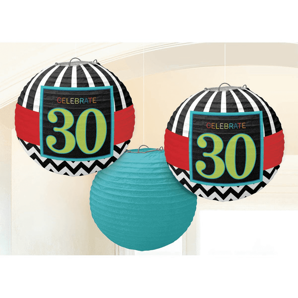 Black paper lanterns with red bands and blue "Celebrate 30" labels, plus a solid teal lantern.