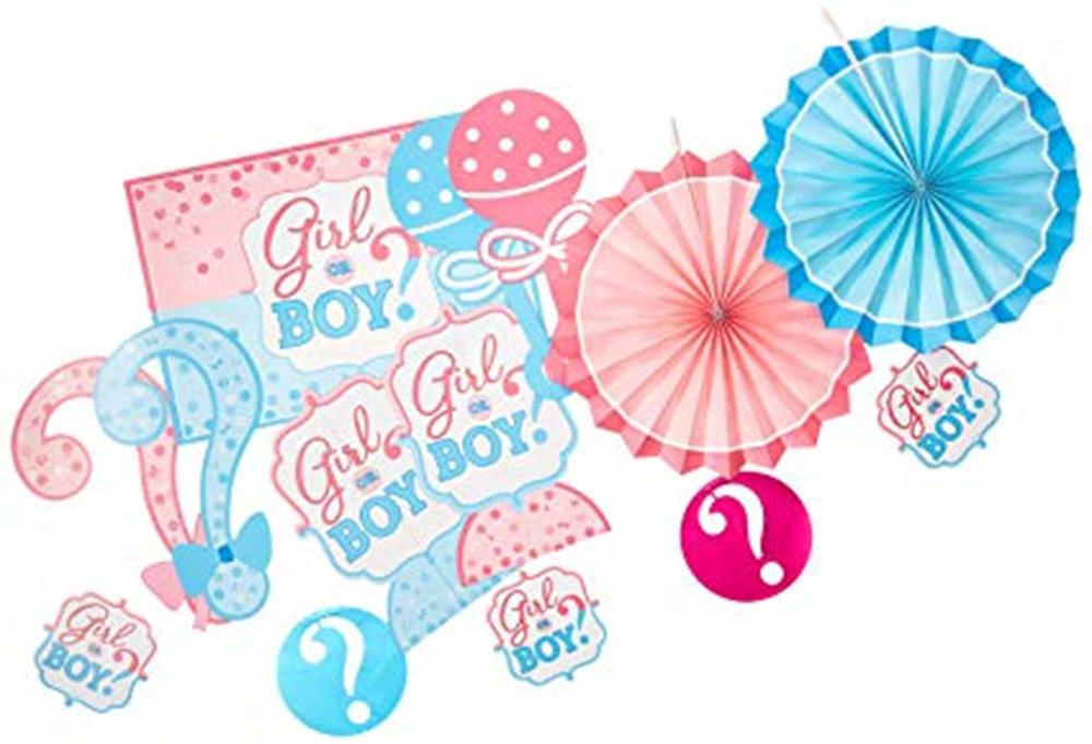 Colorful gender reveal decorations including pink and blue paper fans, question mark signs, and signs reading "Girl or Boy?"