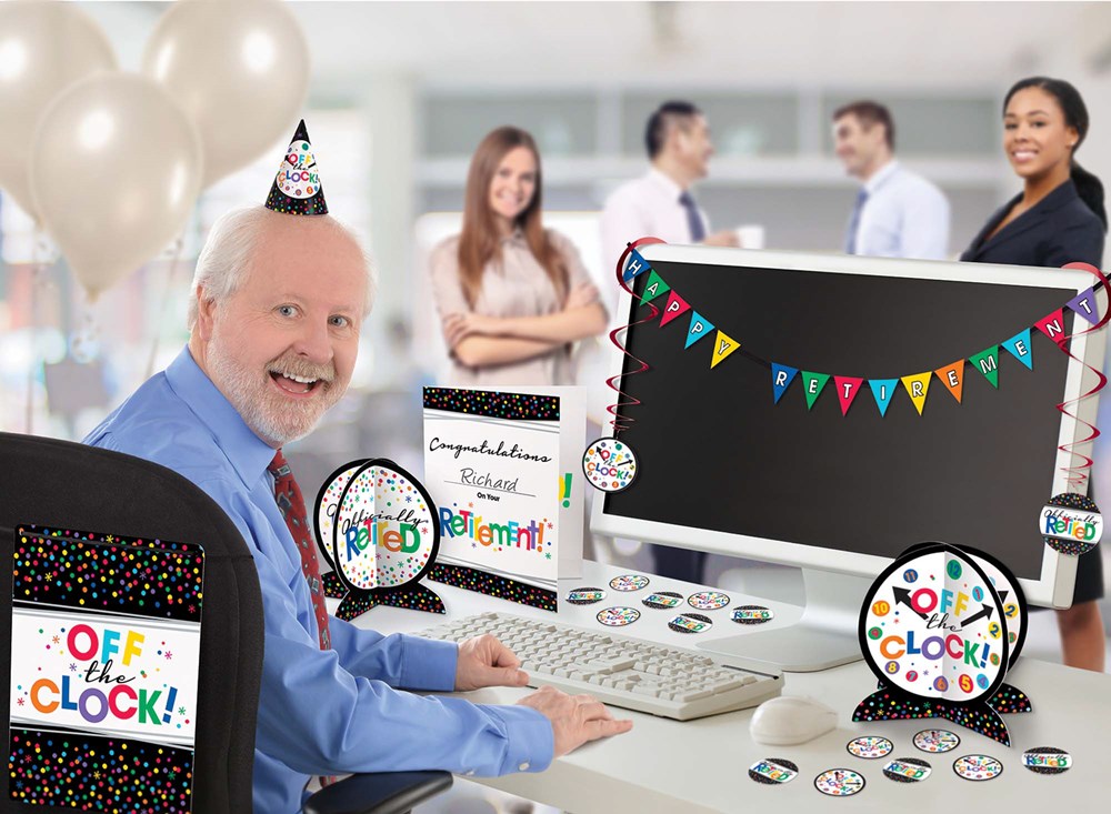 Colorful retirement party decorations featuring a black computer monitor with a multicolor pennant banner and "Off the.