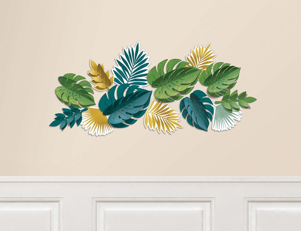 Colorful tropical leaf wall decoration in green, teal, yellow, and white on beige background.