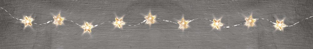 Warm white star-shaped LED fairy string lights on a thin silver wire with battery pack.