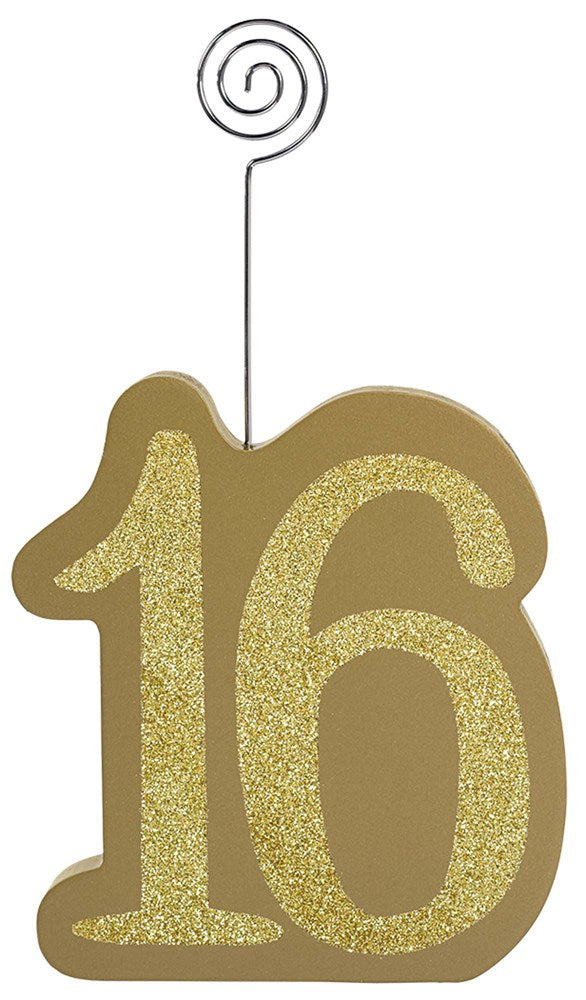 Blush pink MDF decoration shaped as number 16 with gold glitter front and attached silver spiral photo holder.