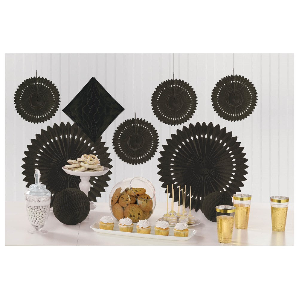 Set of nine black paper party decorations including fans and rosettes in various sizes, arranged on a white backdrop.