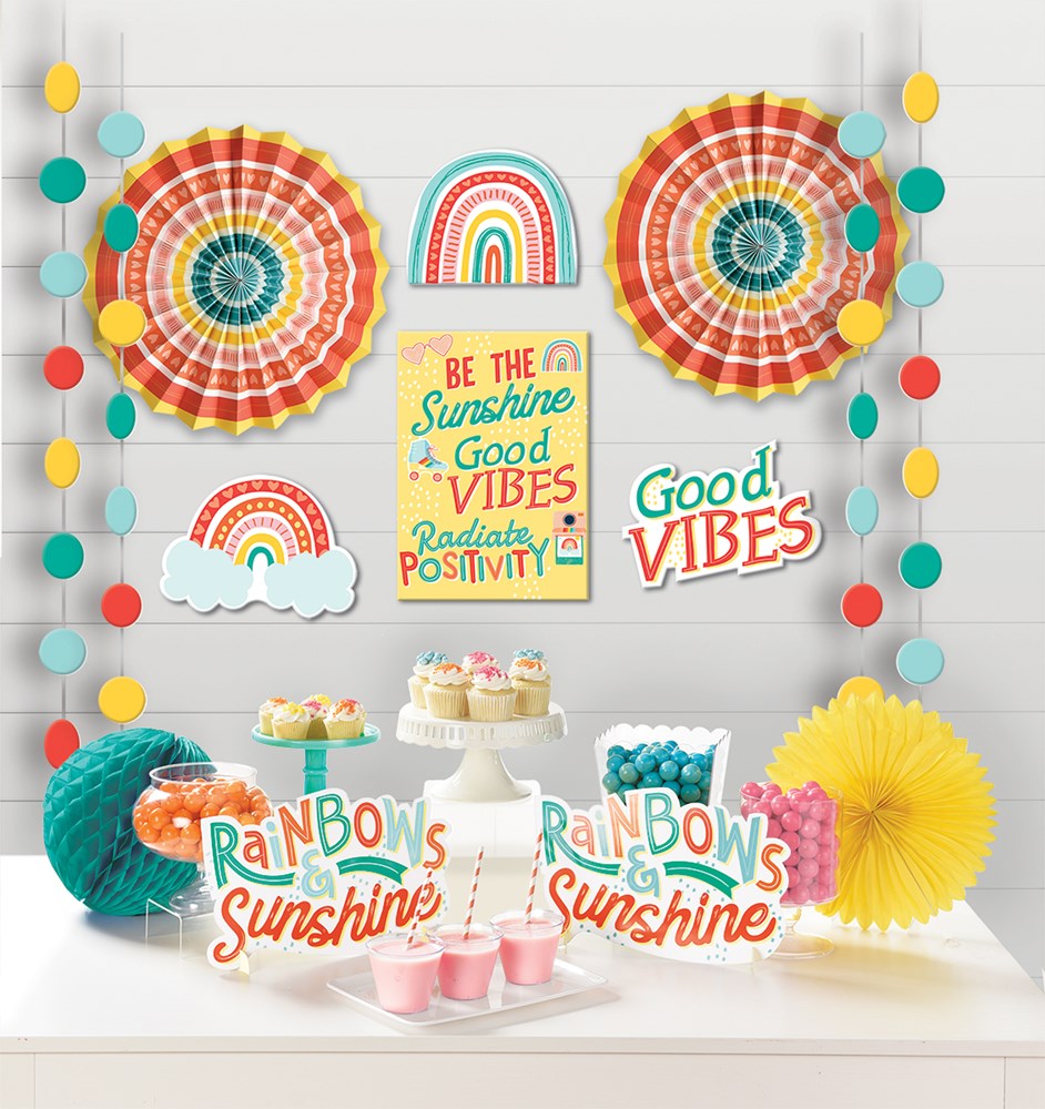 Colorful retro rainbow-themed room decor set with paper fans, honeycomb balls, rainbow cutouts, and positive vibe signs.