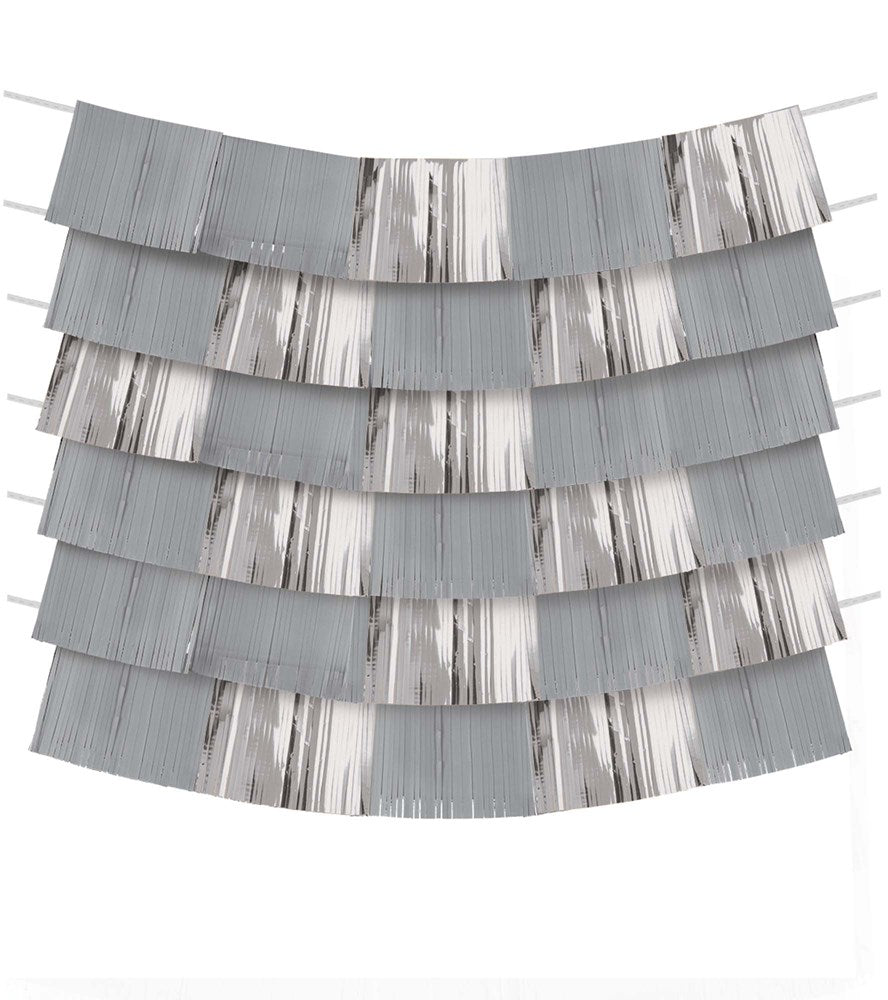 Shiny silver foil backdrop with horizontal strips creating a shimmering curtain effect.