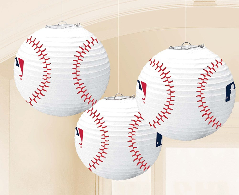 White round paper lanterns designed like baseballs with red stitching and MLB logos.