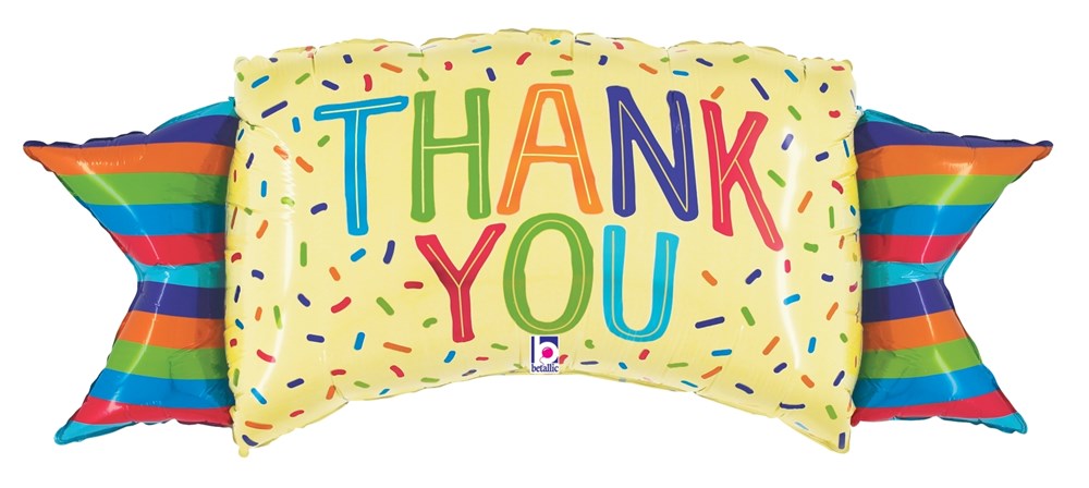 Yellow rectangular foil banner with colorful "THANK YOU" text and confetti designs, flanked by rainbow-striped triangular.