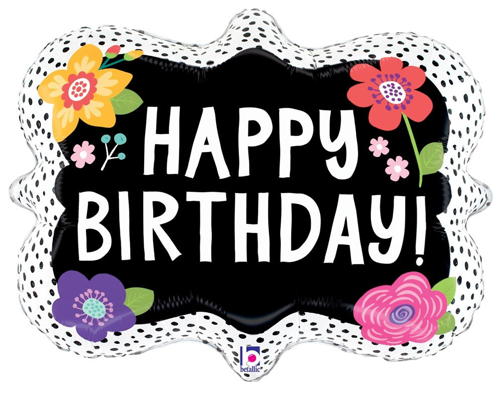 Black scalloped-edge foil balloon with colorful flower designs and bold white "Happy Birthday!" text.