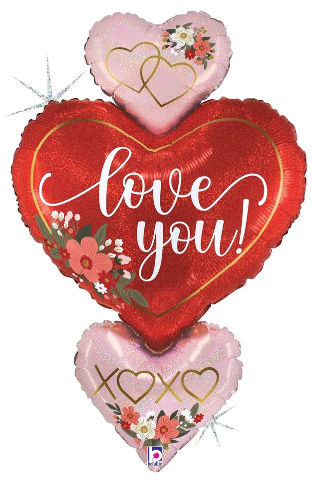 30-inch glittery holographic heart-shaped balloon trio with floral accents, red and pink colors, "Love You" and "XOXO" text.