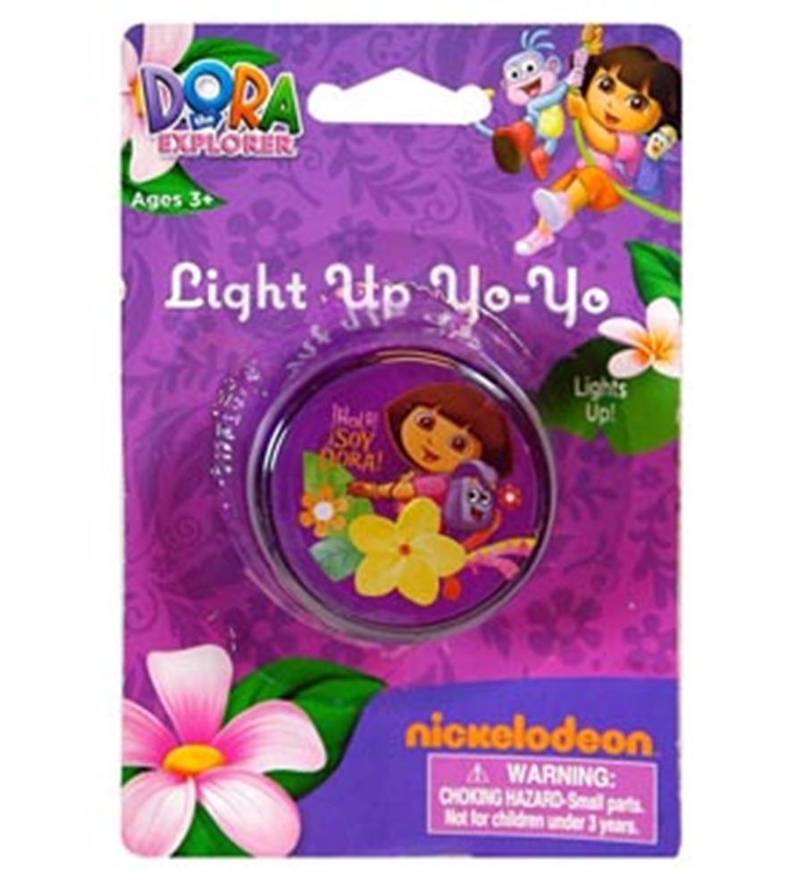 Purple plastic yo-yo featuring Dora the Explorer with yellow flowers, packaged on a purple card with floral designs.