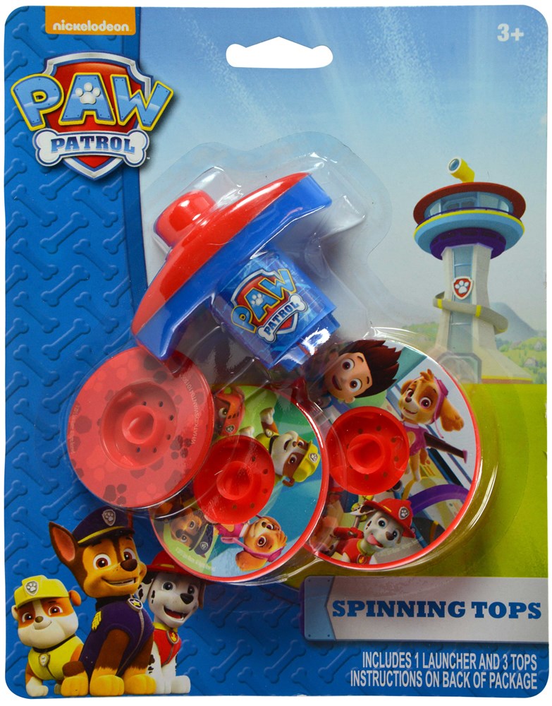 Colorful Paw Patrol spinning tops with character designs and a red launcher in clear packaging.