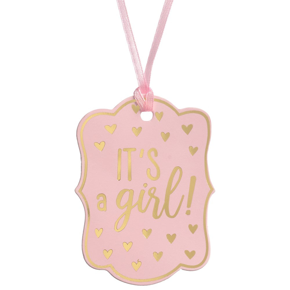 Pink scalloped rectangular gift tag with gold foil hearts and "It's a girl!" text, tied with pink ribbon.
