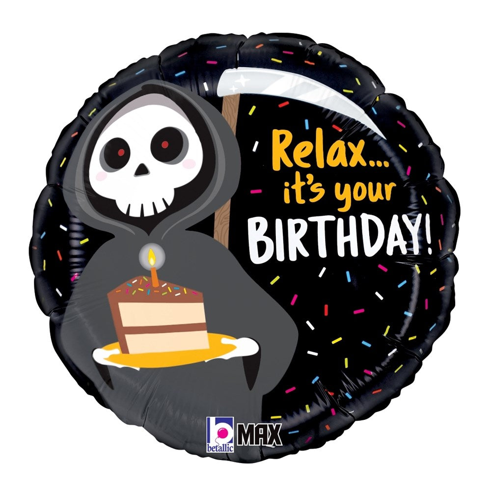 Round black foil balloon featuring a cartoon grim reaper holding a birthday cake, with colorful sprinkles and "Relax - it's.