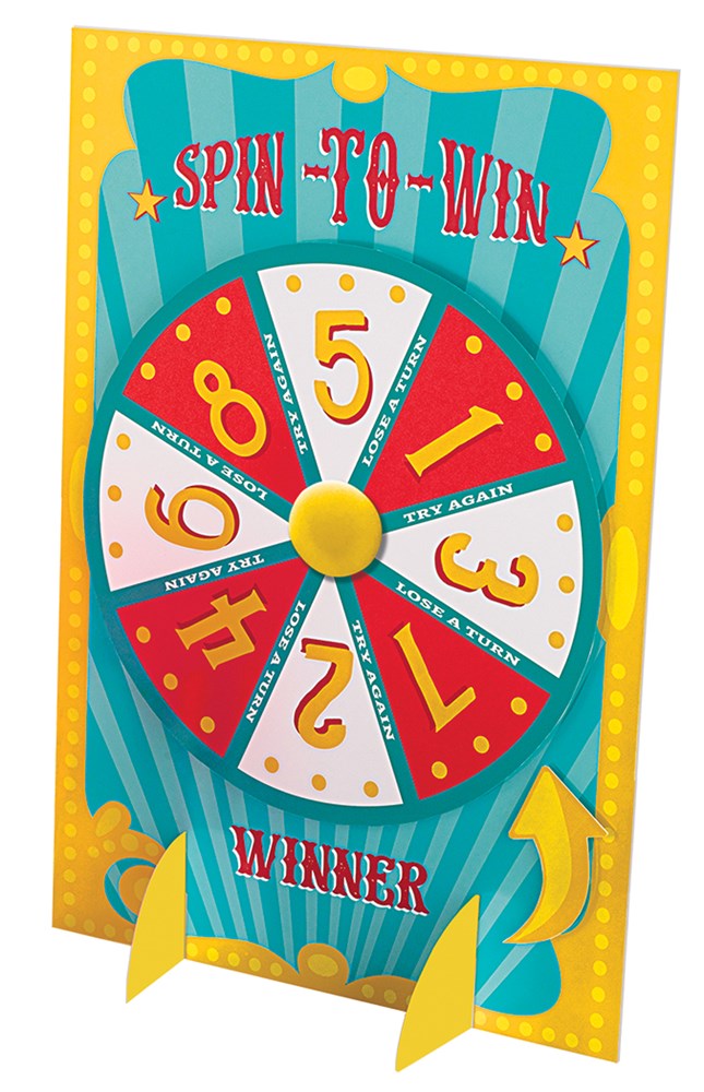 Colorful carnival prize wheel with red, yellow, and white numbered sections on a yellow and blue stand with "Spin to Win".