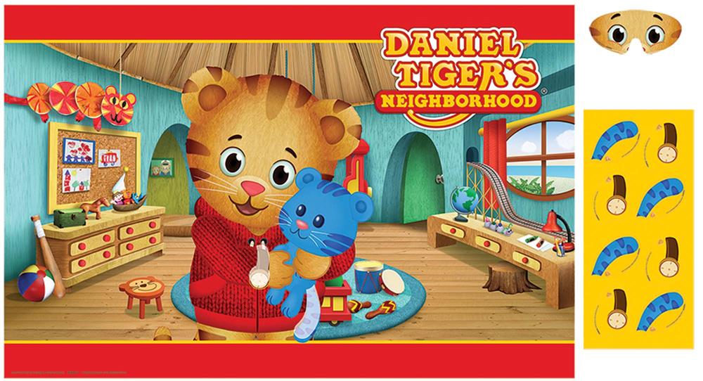 Daniel Tiger plush toy holding blue cat figure in colorful animated playroom with yellow and blue card pieces.
