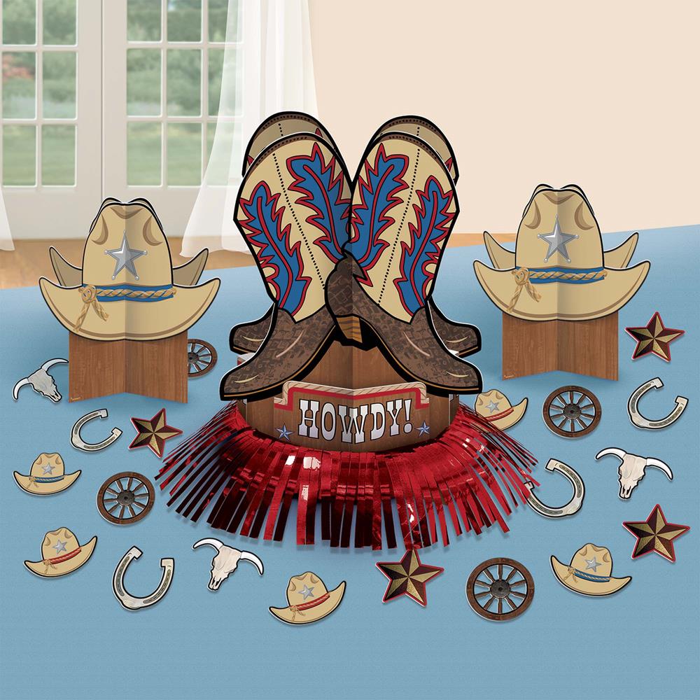 Western party centerpiece with red metallic fringe, cowboy boots, and hats featuring blue stars and lasso designs.