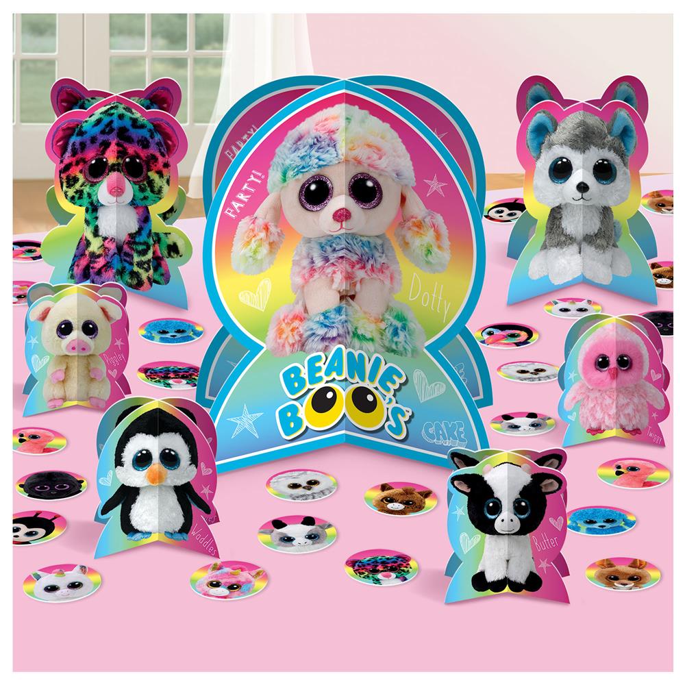 Colorful Beanie Boos table decoration set featuring various plush animal characters and circular confetti on a pink surface.