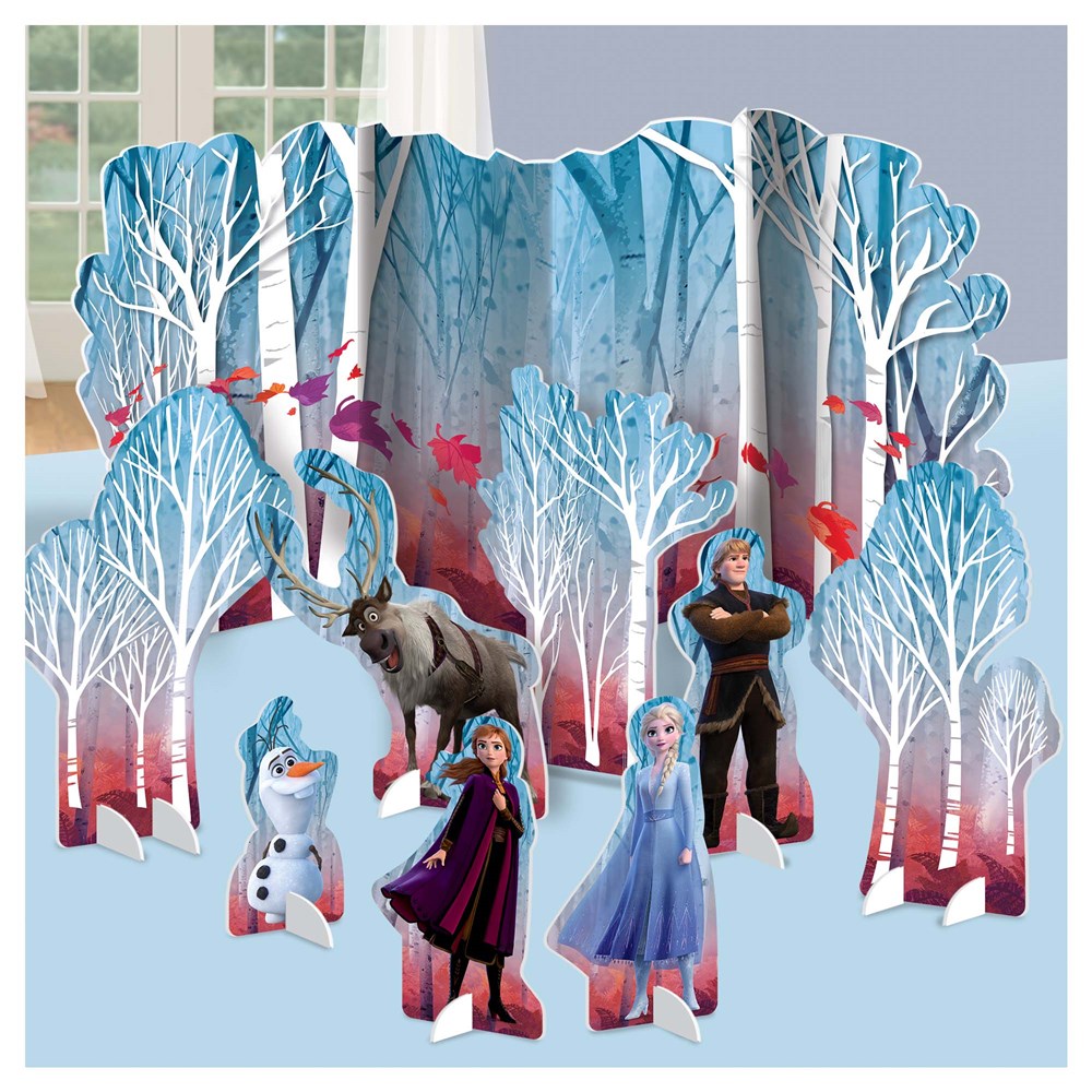 Frozen 2 table decorating kit with cardboard cutouts of trees, Elsa, Anna, Olaf, Kristoff, and Sven in blue and white tones.