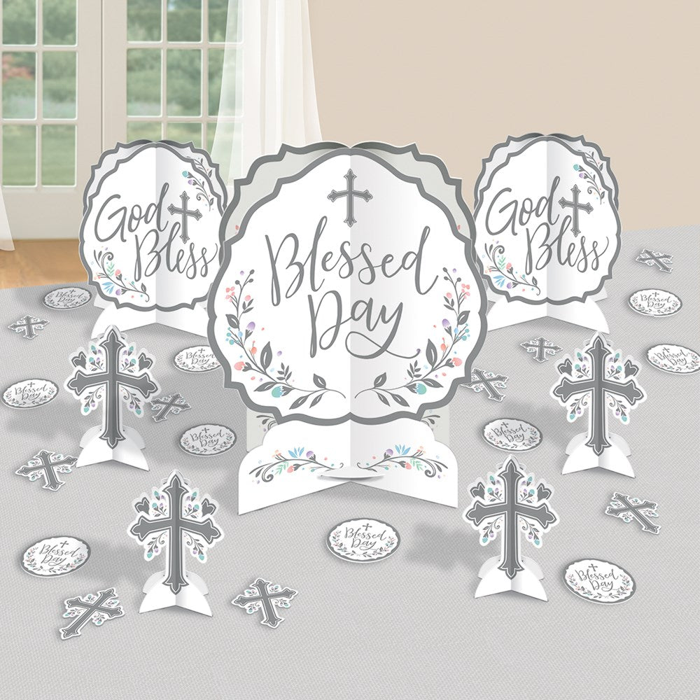 White and silver paper table decorations with crosses and religious phrases like "Blessed Day" and "God Bless," featuring.