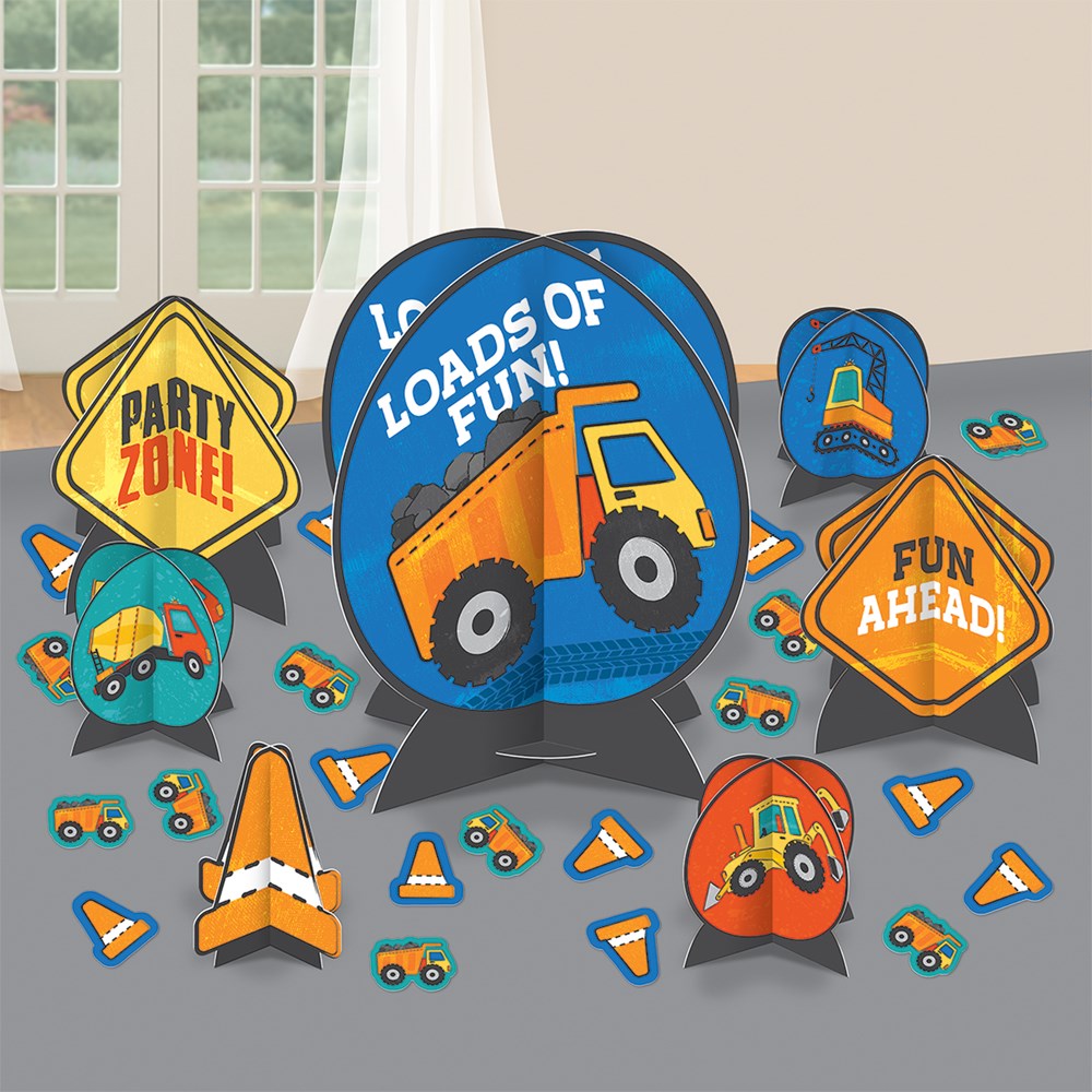 Construction-themed party table decorating kit with signs, cones, dump truck and excavator illustrations in bright orange,.