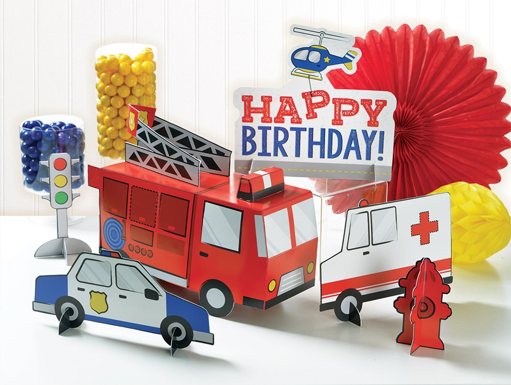 Table centerpiece kit with red fire truck, white ambulance, blue police car, traffic light, fire hydrant, colorful candy.