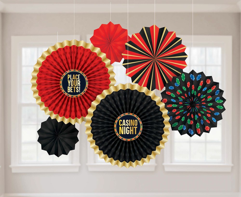 Six decorative paper fans in red, black, and gold with casino-themed text and patterns, hanging display.