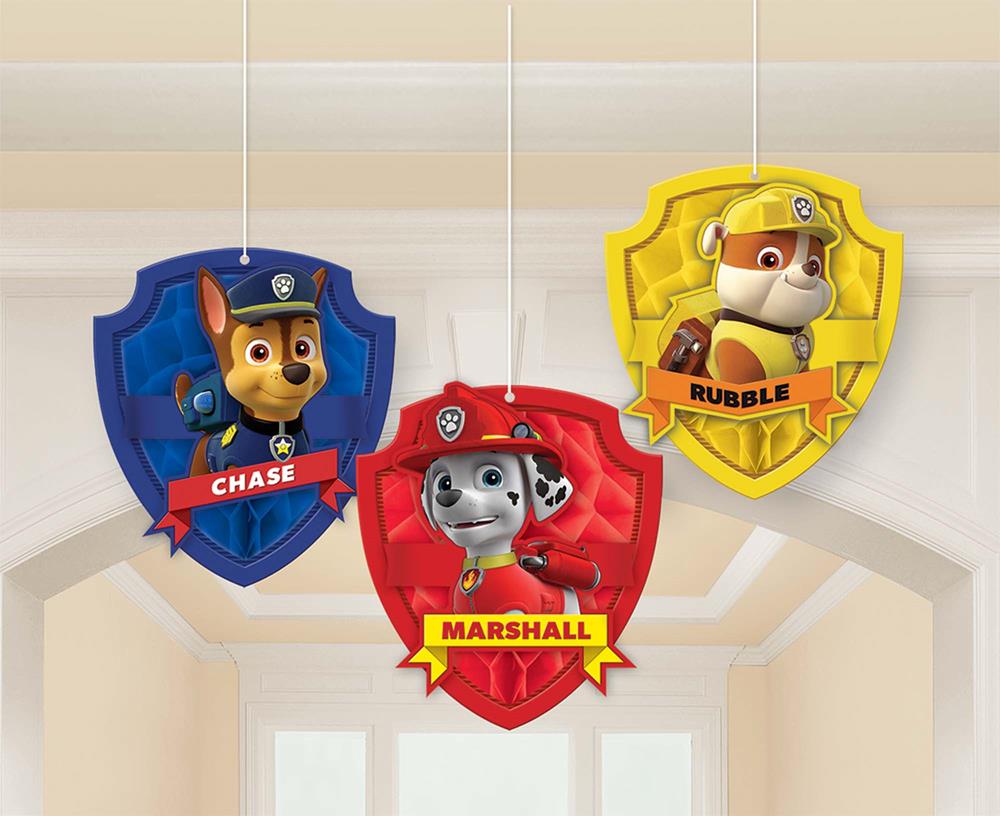 Paw Patrol honeycomb hanging decorations featuring Chase, Marshall, and Rubble badges in blue, red, and yellow.