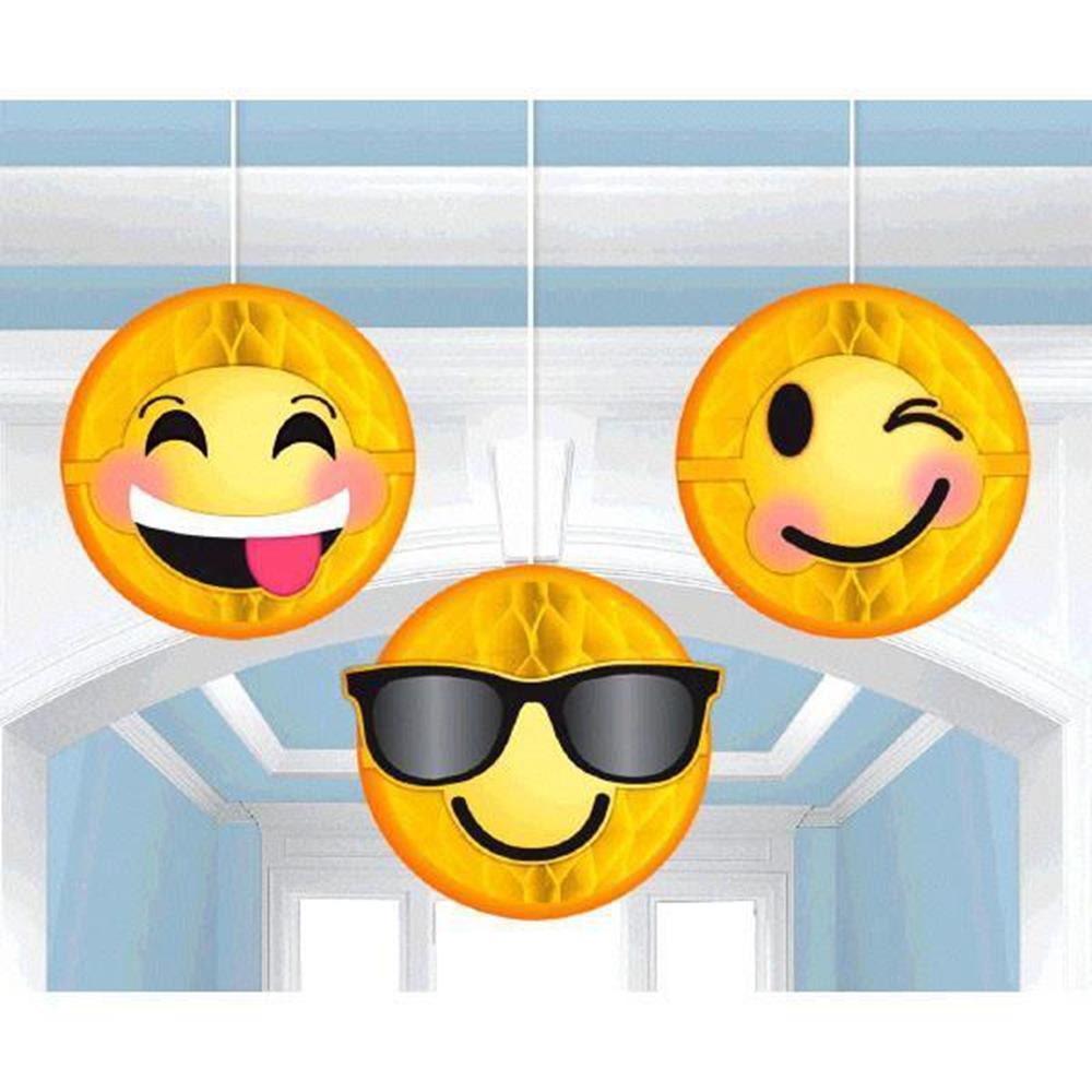 Three round yellow emoji decorations with smiling faces, including tongue out, winking, and sunglasses, hanging by strings.