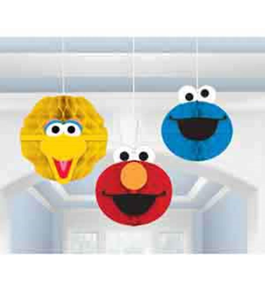 Yellow honeycomb decoration with Big Bird face, red with Elmo face, and blue with Cookie Monster face hanging decor.