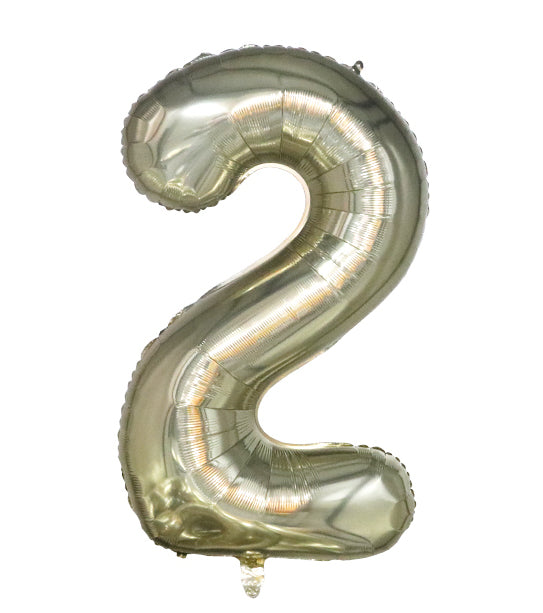 Large shiny gold foil balloon shaped like the number 2 with a smooth inflated surface.