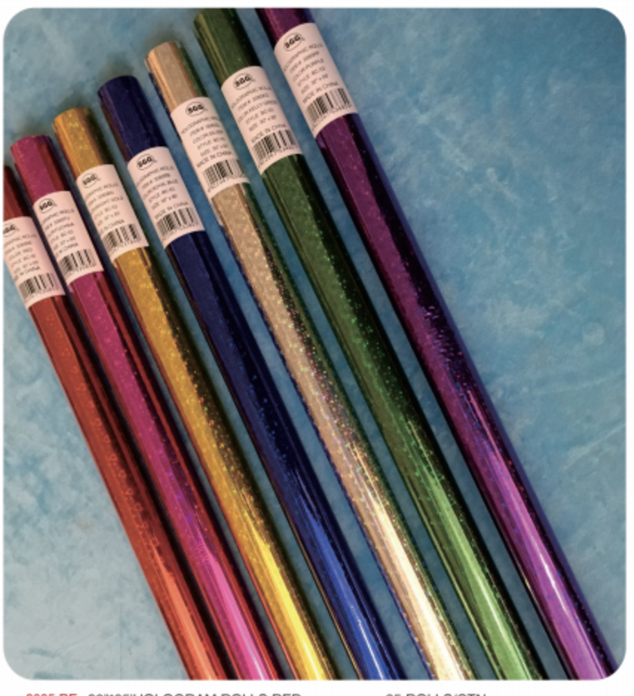Rolls of shiny holographic wrapping paper in gold, green, blue, purple, and red hues with a metallic finish.