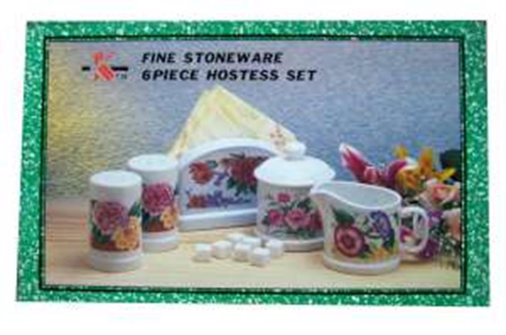 White stoneware 6-piece hostess set with pink and red floral designs, including mugs, canisters, sugar bowl, and napkin.