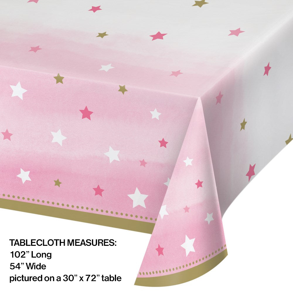 Pink and white plastic table cover with scattered pink, gold, and white stars, measuring 54 by 102 inches.