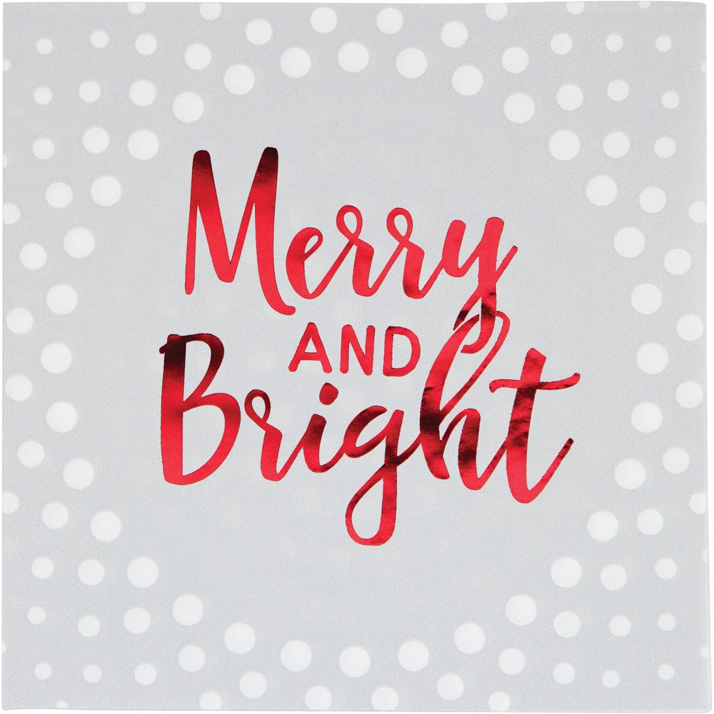 Gray lunch napkin with white polka dots and shiny red "Merry and Bright" script in center.
