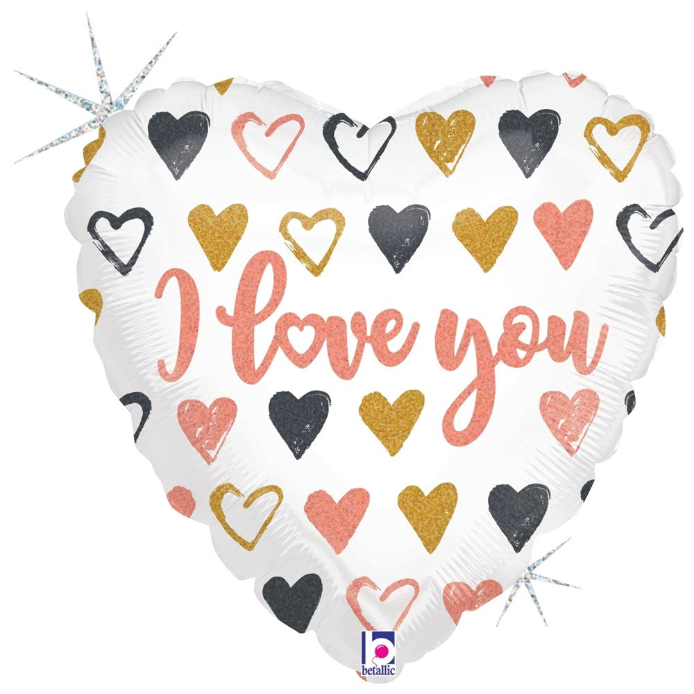 White heart-shaped balloon with pink, black, and gold hearts and "I love you" scripted in pink glitter holographic letters.