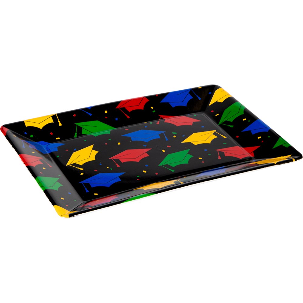 Rectangular black plastic tray with colorful mortarboard caps in red, yellow, green, and blue scattered across the surface.