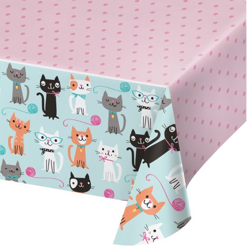 Light blue party tablecover with colorful cartoon cats and yarn balls, pink polka dot top surface, rectangular shape.